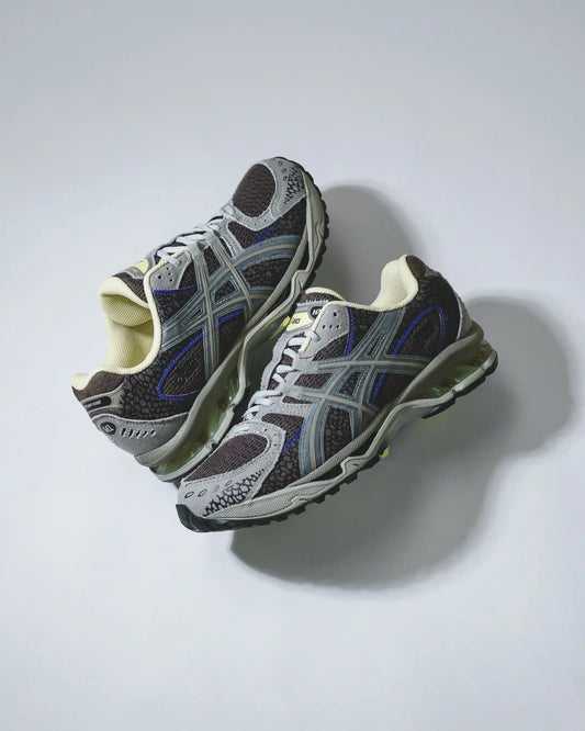 Asics running shoe, navy and gray with white accents.