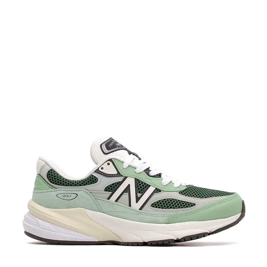 A New Balance 990v6 sneaker in mint green and white.
