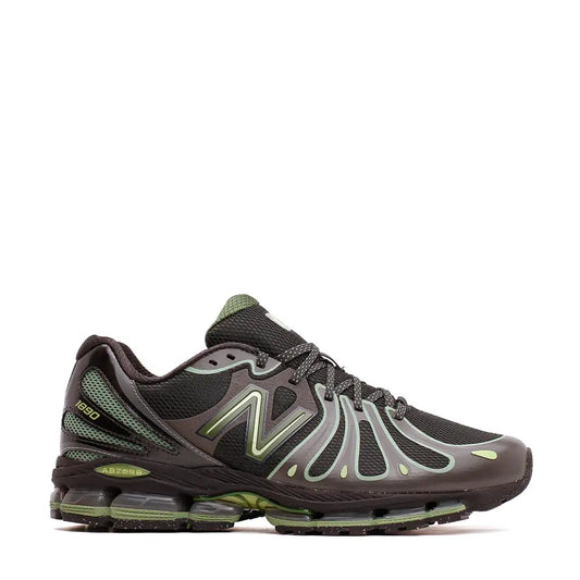 Dark gray and olive green new balance 1990 sneaker with mesh upper, translucent overlays, and a cushioned air unit sole.