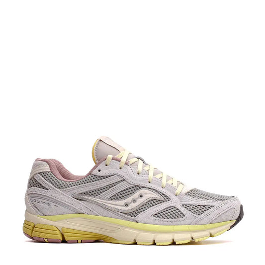 A light gray saucony guide 7 running shoe with mesh and suede upper, pale yellow laces and sole accents, and a pink interior lining.