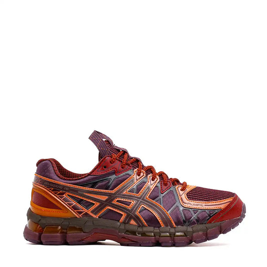 Maroon and orange athletic shoe with textured detailing.
