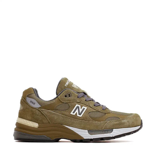 Olive green New Balance 992 running shoe with grey laces.