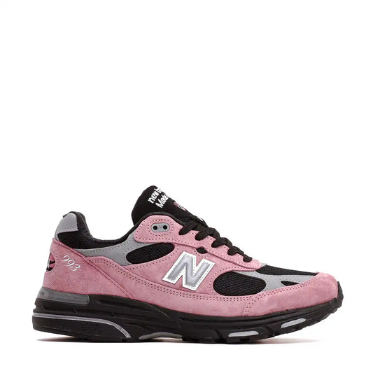 Pink and black new balance sneaker with white accents.