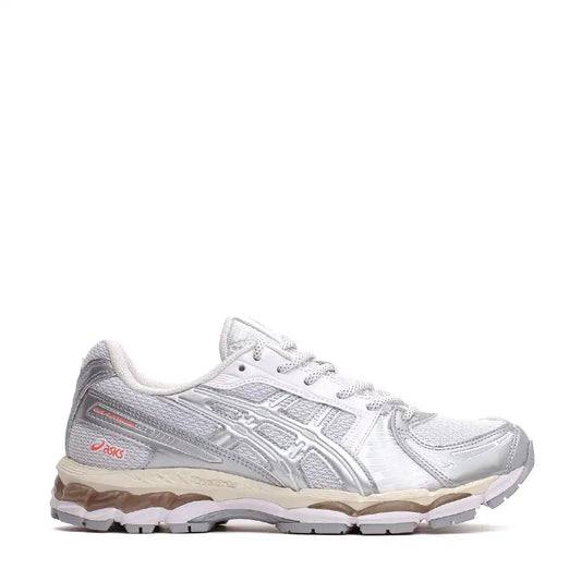 White asics running shoe with pink accents and textured upper material.