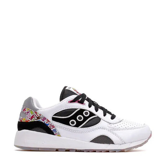 White and black athletic shoe with colorful abstract pattern on the heel.
