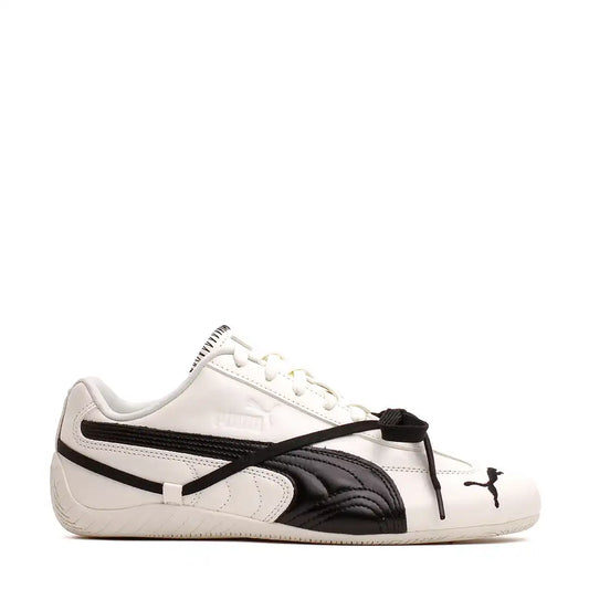 White and black leather Puma sneakers with a unique lacing system.